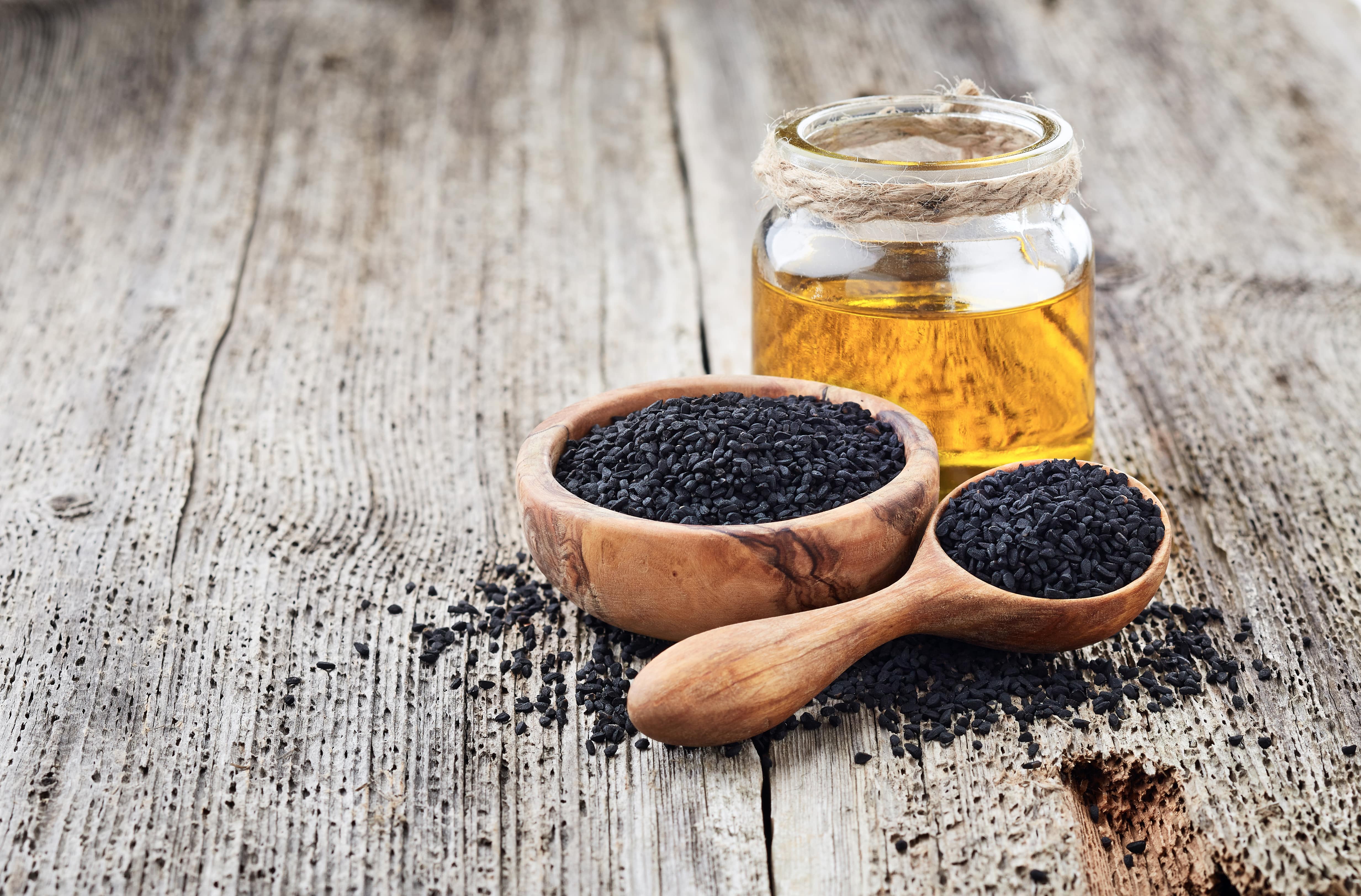 files/black-cumin-oil-with-seeds-on-wooden-background-2023-11-27-05-21-06-utc-min.jpg